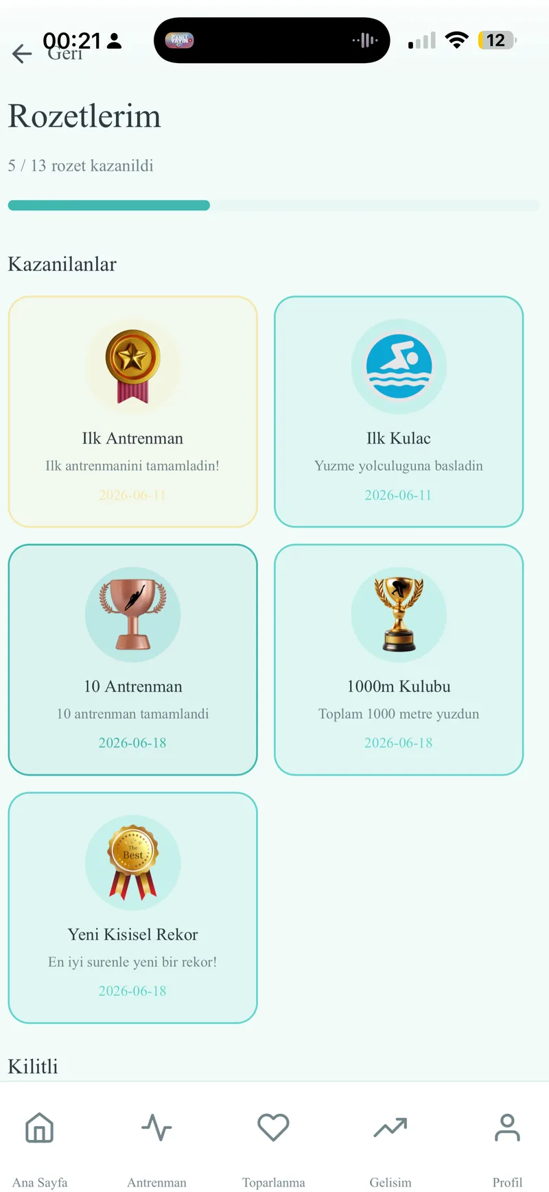 MiniPeak Swim achievement badges screen showing earned swimming milestones